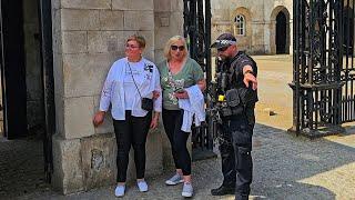 ABUSE BY IDIOT AFTER POLICE OFFICER asks ladies TO MOVE during the Guard change at Horse Guards!