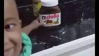 Kid spelling Nutella “PEANUT BUTTER”