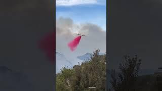 Large airtanker struggles to fly and drop fire retardant on Pacific Palisades wildfire