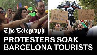 Anti-tourism protesters soak diners with water pistols in Barcelona