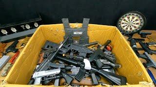 Box of Black Realistic Guns, Capsule Detonator and Bead Shot Pistols