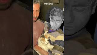 Palestinian boy rescued from the rubble refuses to part with his cat