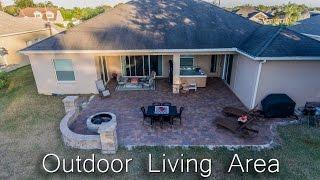 Outdoor Living Area Renovation with Brick Pavers, Fire Pit and 7 Person Hot Tub