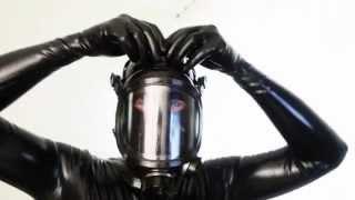 Man in latex full catsuit and gas mask
