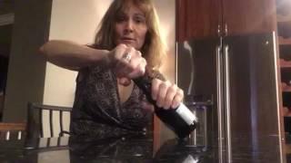 How to open a small sparkling wine bottle with a plastic top