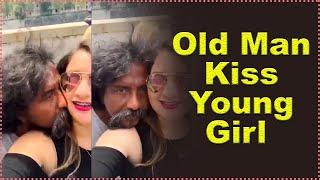 old man kiss young girl in public place