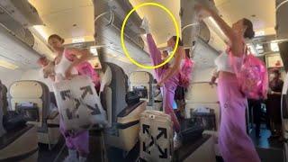 Viral Video | Mother Love | Woman Closes Plane’s Overhead Bin With Foot While Holding Baby in Arm