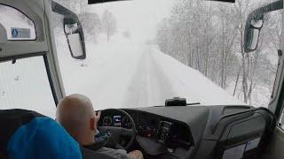 Bus drive in the Alps, snow season,  4K