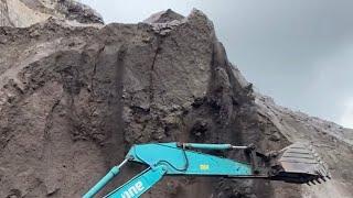 Sand mining | Heavy excavator equipment works to dredge sand