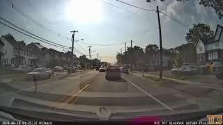 Car passes cars and between lanes nearly striking child