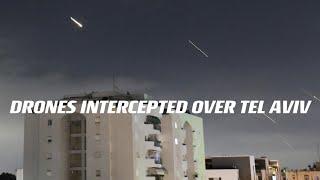 WATCH: Lights streak across Tel Aviv sky as Iranian drones are intercepted by Israeli forces