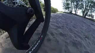 Lauf Carbonara on a 29er+ wheels set to show it's travel and movement over a standard gravel track