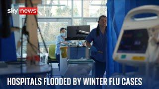 Winter flu cases 'rapidly rising' as NHS warns hospitals are being flooded