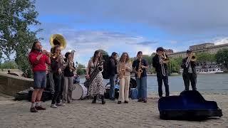 Wind band in Paris on the bank of the Seine