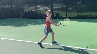 7 year old tennis player Zac Davidoff practicing