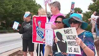 Protest held outside CDC over new COVID-19 shot guidelines