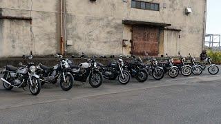 Ten classic motorcycles together, riding in formation.