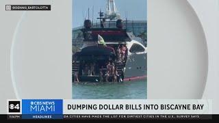 Viral video showing boaters dumping dollar bills into Biscayne Bay sparks police investigation