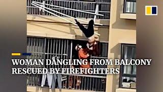 Elderly woman dangling from balcony rescued by firefighters in China