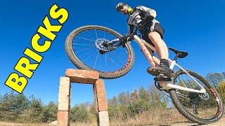 Mountain Bike And 10 Bricks. Cross Country Skills Exercises.