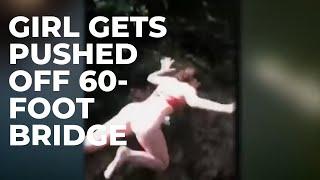 Girl gets pushed off 60-foot bridge