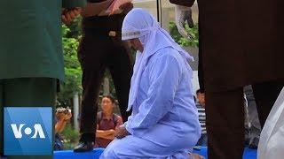 Indonesia: Woman Collapses After Being Caned for Public Affection