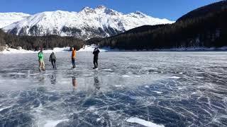 Ice skating on a frozen lake in Switzerland