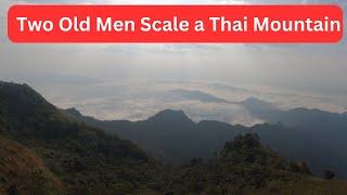 Two old Men scale A Thai Mountain Puchi Dow Chiang Rai Northern Thailand