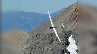 Glider Looping Near Mountain