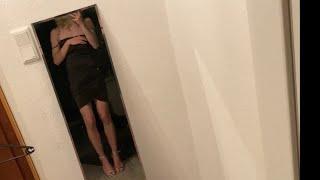 crossdresser in short black dress and high heels 