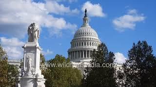 United States Capitol in brilliant fall colours and autumn light against blue skies, Washington DC