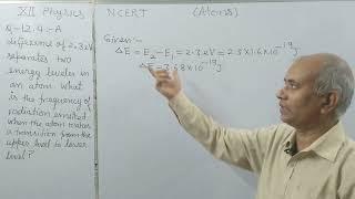 A difference of 2.3 eV separates two energy levels in an atom. What is the frequency of radiation