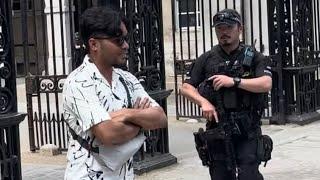 DISGUSTING!! blocking the Horse’s Path during Changing of the Guards.  GUARD SHOUTS at Him.