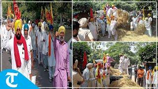 Kirti Kisan Union farmers unload paddy stubble outside DC office in Bathinda