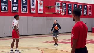 Houston assistant Kellen Sampson teaching defensive drills to 4s and 5s