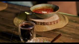 Close-up salad, tea glass and soup on rustic table.