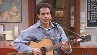 Tony Shalhoub plays guitar and sings in Wings