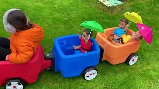 Ride on Wagon with baby dolls and Umbrellas