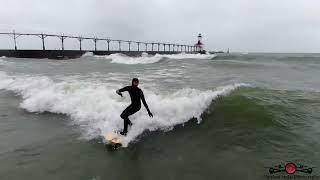 Surfing Lake Michigan In A Winter Storm 4K Drone Footage Michigan City Indianan