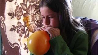 Blowing up a balloon inside another balloon.