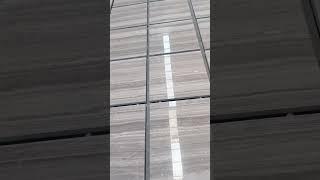 GREY WOOD MARBLE DURING DRY LAYING