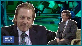 1990: DONALD SUTHERLAND on EARS, EYES and not being the GUY NEXT DOOR | Wogan | BBC Archive