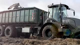 Black HYDREMA 922F hooklift with container transporting carrots