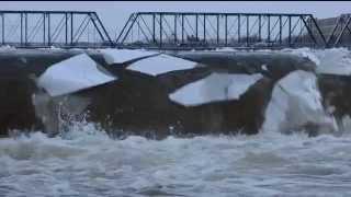 Mesmerizing sheets of ice break over Grand River waterfall