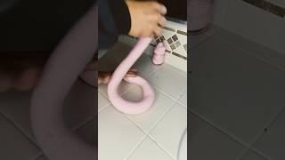 Spraying pink butter slime with sea salt