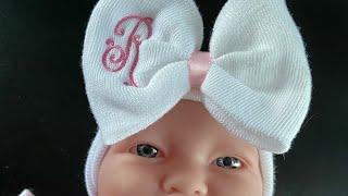 Machine Embroidery Monograming an Infant Bow Hat - Stitchin’ With Sue