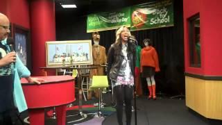 Melanie Fiona performs while visiting the Red Velvet Cake Studio.