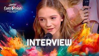 Zoé Clauzure on stage interview with Olivier Minne | Junior Eurovision 2023