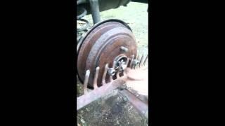 How to remove stuck drum disc brake with a rake