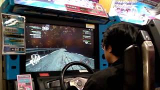 A Japanese business man playing initial D 5 and showing how it's done.